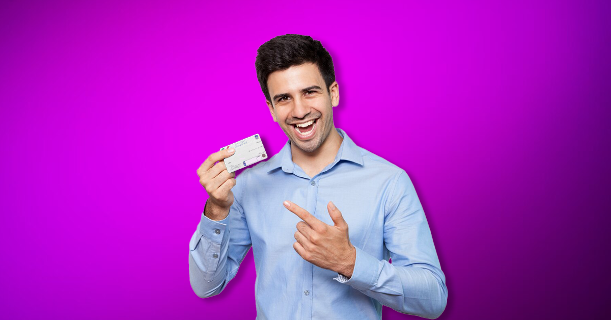 The copy of the car card is in the hand of the smiling man