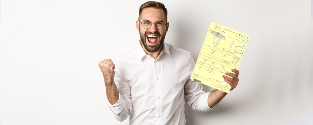 The copy of the document of the car company is in the hands of the happy man in the cream shirt